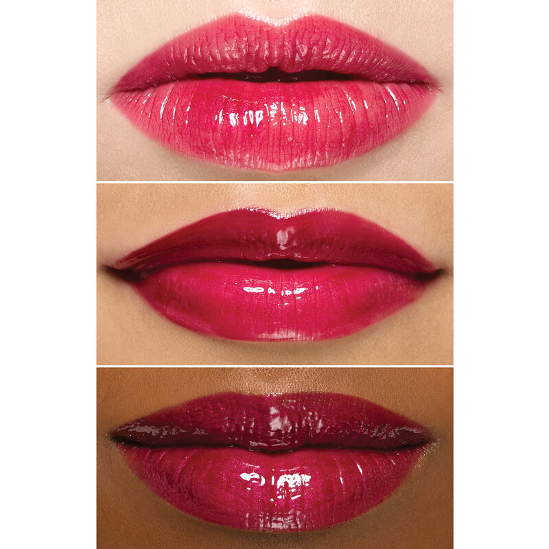Close up of lips wearing Mary Kay Unlimited Lip Gloss in shade Berry Delight on an ivory, bronze and deep skin tone.