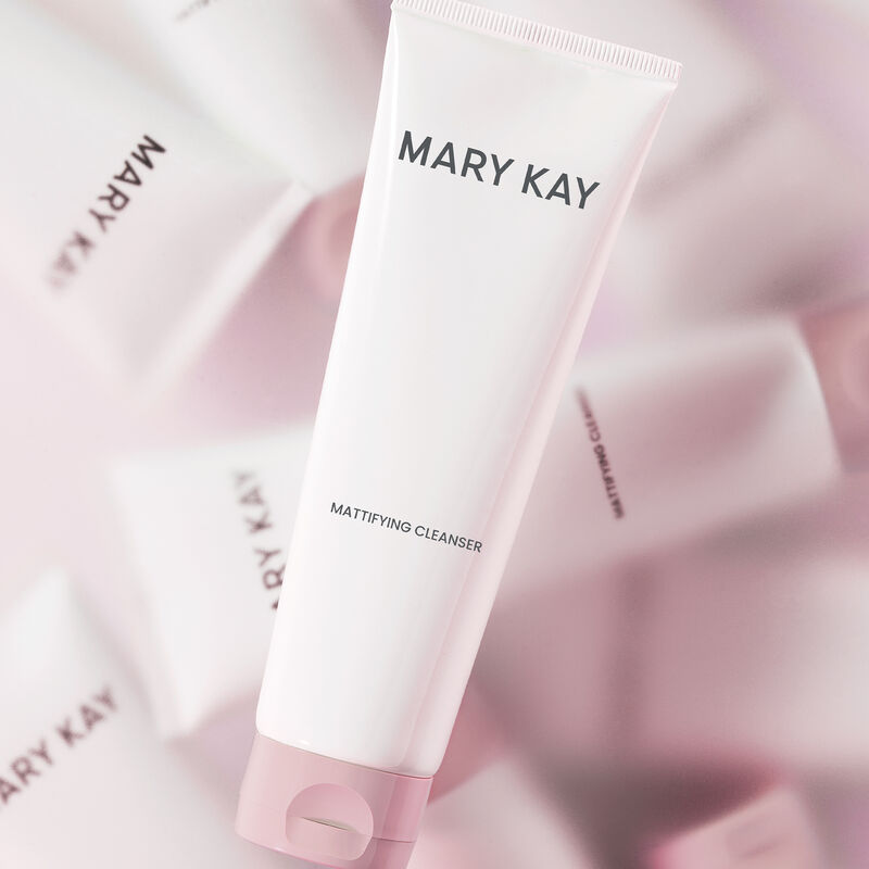 Tube of Mary Kay Mattifying Cleanser in the forefront with multiple bottles of the same in blurry kaleidoscope effect image number null