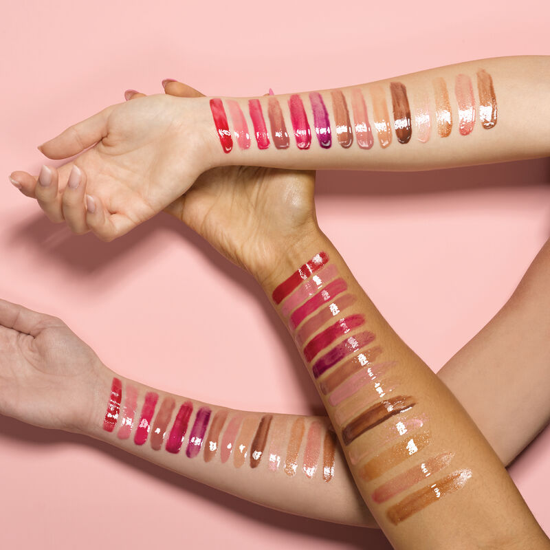 Arm swatches on ivory, bronze and deep skin tones of all shades of Mary Kay Unlimited Lip Gloss. image number null