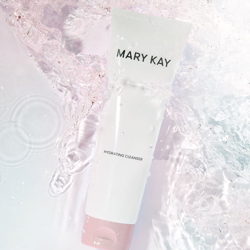 Tube of Mary Kay Hydrating Cleanser immersed in water with a slight pink tint image number null