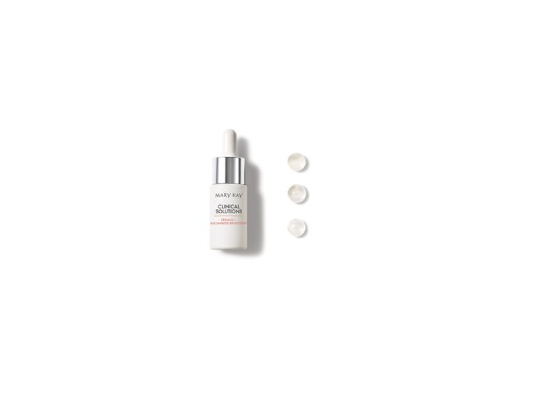 Bottle of Mary Kay Clinical Solutions Ferulic + Niacinamide with droplets beside it