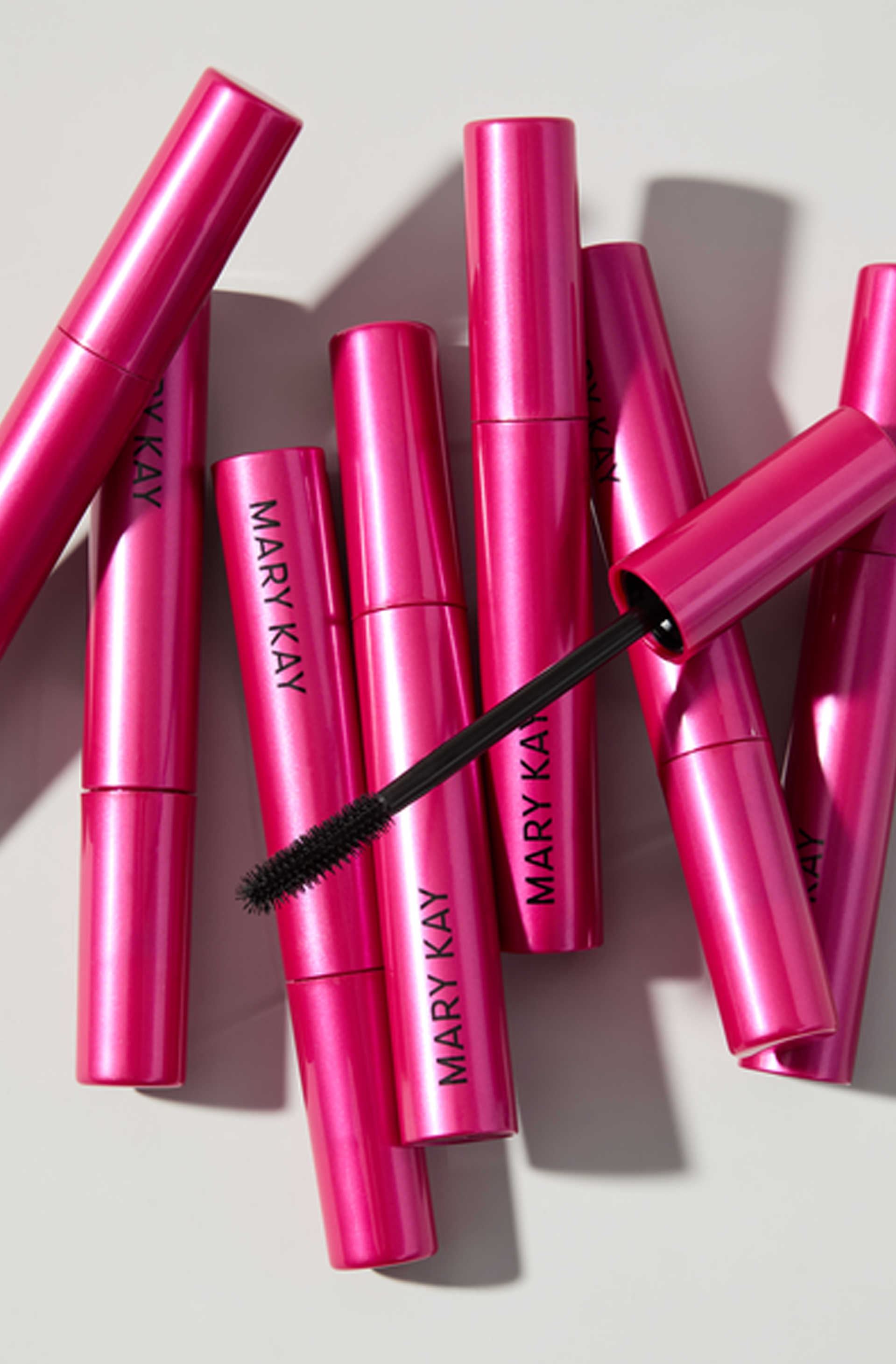A pile of Mary Kay Fanorama Mascara tubes